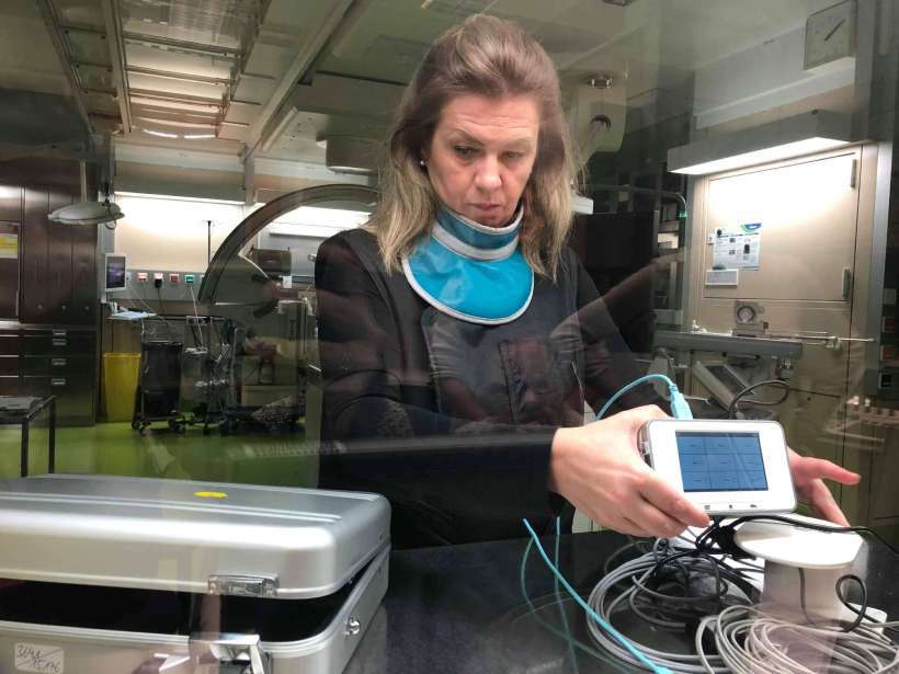 Medical physicist at hospital wearing protective lead aprons